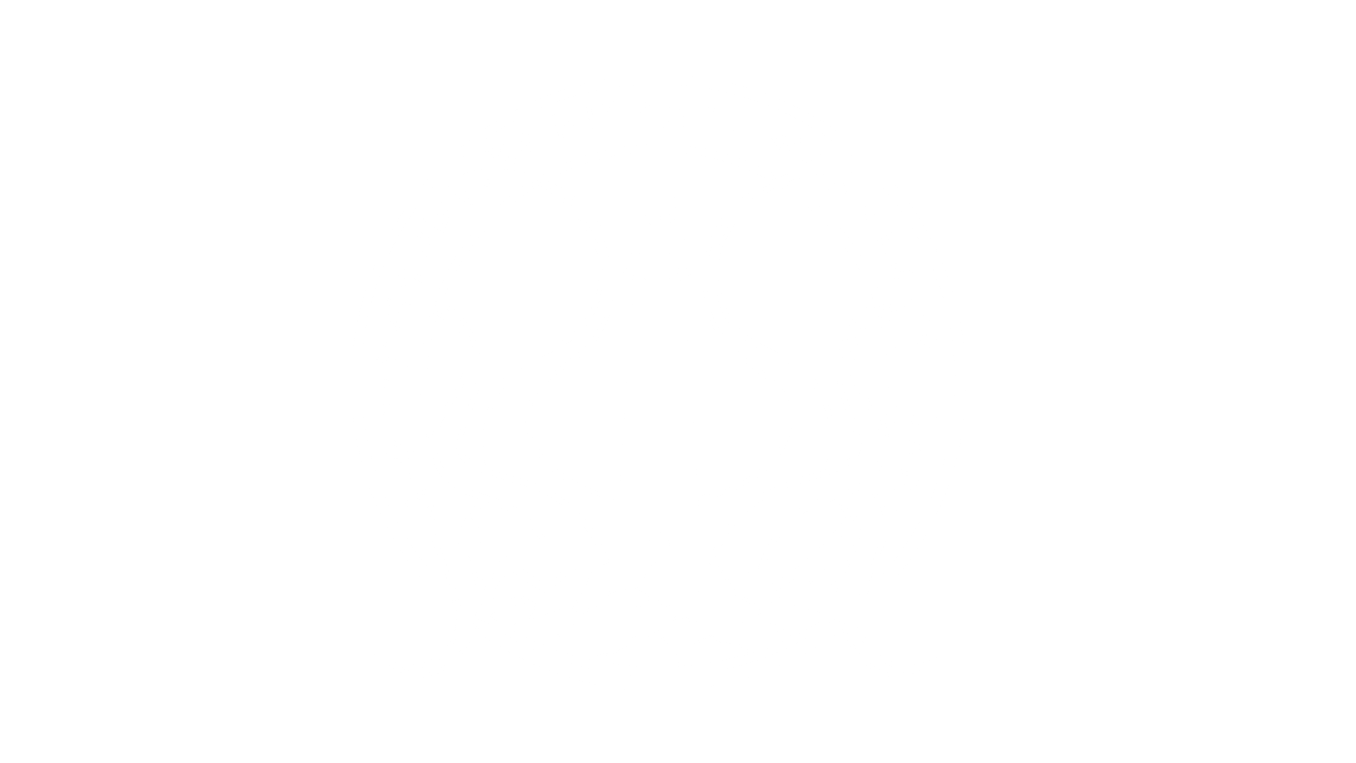 A lighthouse emblem with tentacles surrounding it